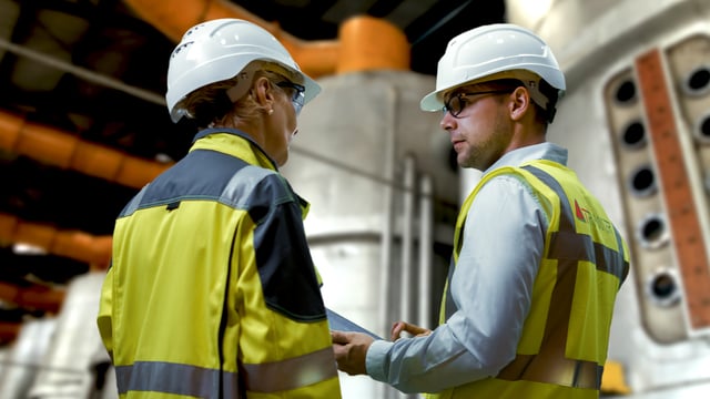 Engineers-discussing-ethanol-background